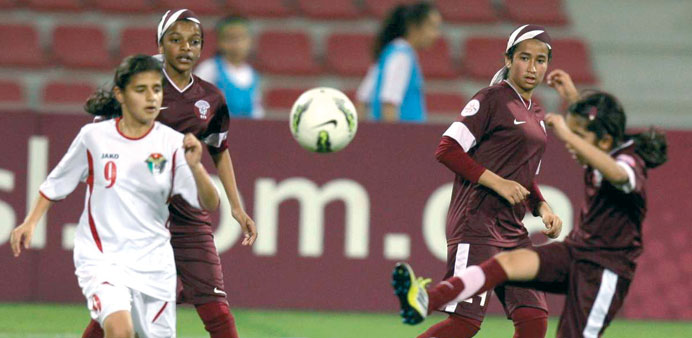 Qatar and Jordan players battle for ball during their AFC U-14s Regional Championships match yesterday. PICTURE: Mohammed Dabbous