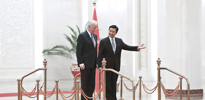 Chinese Vice President Li Yuanchao invites US Vice President Joe Biden to view an honour guard during a welcoming ceremony inside the Great Hall of th