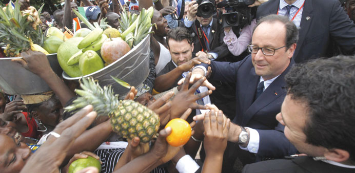 Franceu2019s President Fancois Hollande greets residents at the Place de la Republique in Abidjan. He was in Ivory Coast for a visit yesterday, before con
