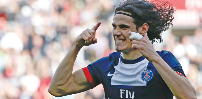 PSGu2019s Uruguayan forward Edinson Cavani reacts after opening the scoring during the French Ligue 1 match against Reims at the Parc des Princes stadium 