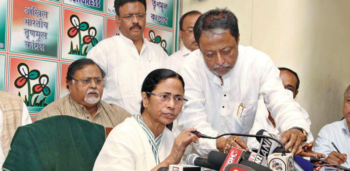 Trinamool Congress Party leader and West Bengal Chief Minister Mamata Banerjee announces the list of party candidates during a press meeting at her re