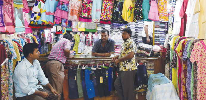Bangladeshi shopkeepers wait for customers in Dhaka yesterday.