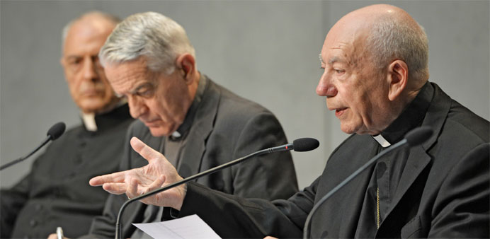 Cardinal Francesco Coccopalmerio (R), president of the Vatican Pontifical Council for Legislative Texts, reads Pope Francis' details on the marriage a