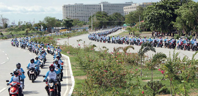    Hundreds of bikers at the Macapagal Avenue yesterday.