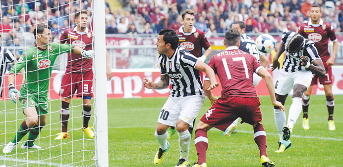 Juventusu2019 Paul Pogba (R) heads the ball to score against Torino during their Serie A match at Olympic stadium in Turin yesterday. (Reuters)