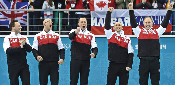 (L-R) Canadau2019s gold medallists Caleb Flaxey, Ryan Harnden, EJ Harnden, Ryan Fry and Brad Jacobs celebrate on the podium during the menu2019s curling flowe