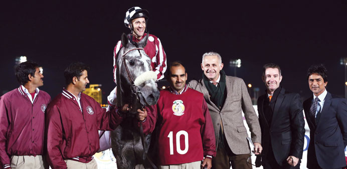Trainer Alban de Mieulle (third from right) leads in Tabarak (Pier Convertino up) after winning the HH Sheikh Abdullah Bin Khalifa Al Thani Cup, a Gro