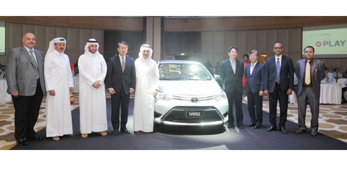 Toyota and Abdulla Abdulghani & Bros officials with Japanese Ambassador to Qatar Kenjiro Monji (fourth from left) at the launch of Yaris 2014 at St Re
