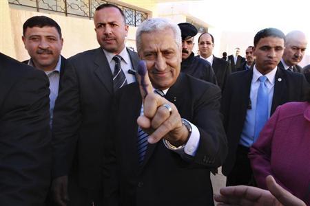 Prime Minister Abdullah Ensour, gestures with his finger, showing the press