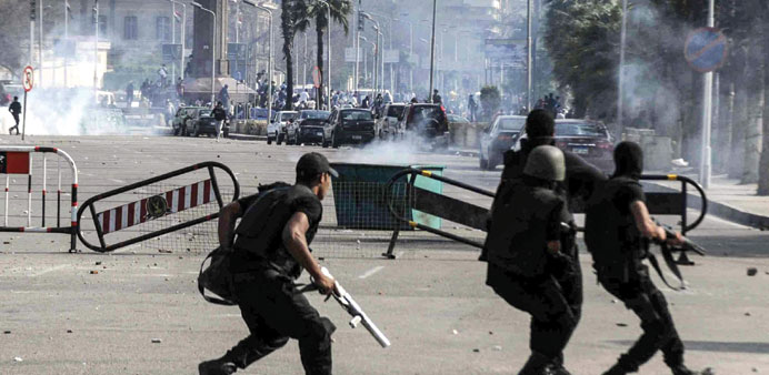 Egyptian anti-riot soldiers are seen during clashes with supporters of the Muslim Brotherhood, near Cairo University yesterday.