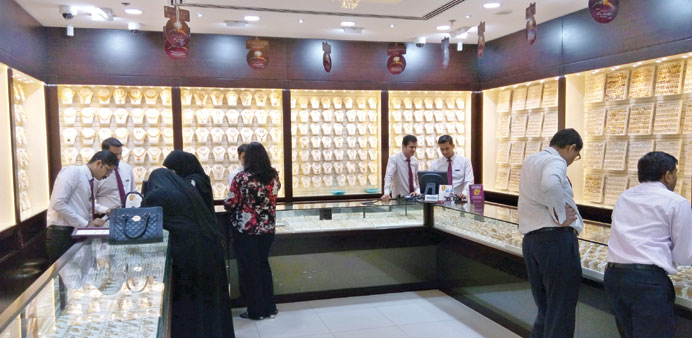 Customers view jewellery at a gold shop. PICTURE: Peter Alagos