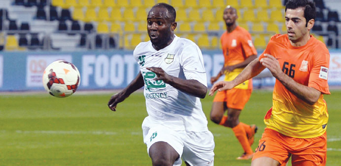 Al Ahliu2019s Alain Dioko (left) in action during a QSL match.