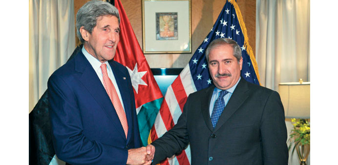  Kerry shakes hands with Judeh during their meeting in Amman yesterday.