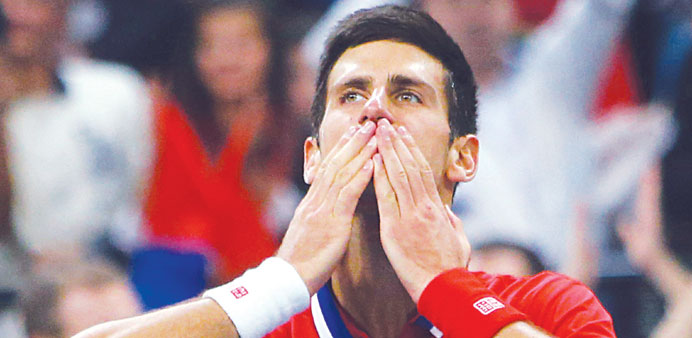 Novak Djokovic of Serbia celebrates his win over Tomas Berdych of Czech Republic in Belgrade yesterday. (EPA)