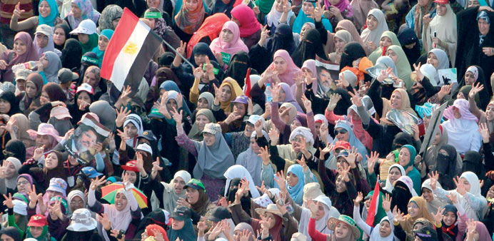 Female supporters of the Muslim Brotherhood attend a protest in support of Mursi outside Rabaa al-Adawiya mosque in Cairo yesterday.