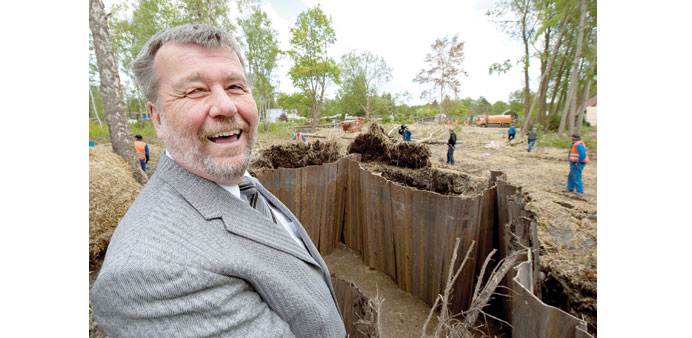 RELIEVED: Hans-Joachim Laesicke, the mayor of Oranienburg, smiles with relief after the programmed detonation in the pit at right of a 500-kilogram US