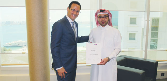 Nasser al-Taweel with the certificate.
