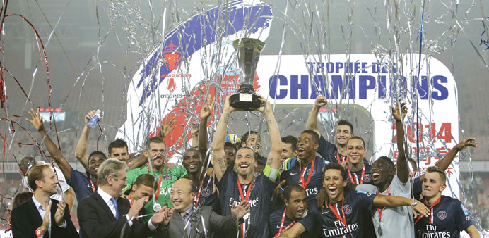 WELL BEGUN: Paris Saint-Germain players celebrate their French Super Cup triumph. The French champions beat Guingamp 2-0 in Beijing yesterday. (Reuter