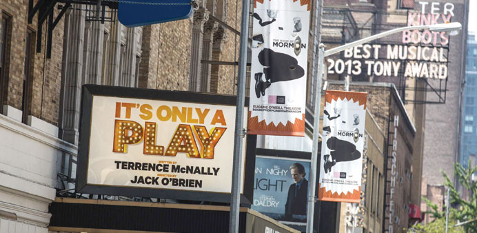 Broadway play marquees are seen near Times Square yesterday in New York City. The Broadway season broke records with 13.1mn attendees and $1.365bn wor