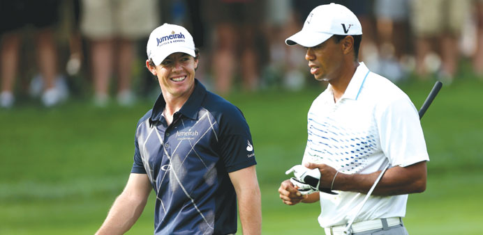 Rory McIlroy (left) and Tiger Woods (right) will be paired together for the first two rounds in the Dubai Desert Classic which begins tomorrow.