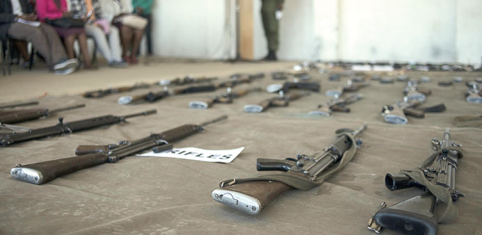 Assault rifles are displayed yesterday at the Makoanyane Barracks in Maseru, during a press conference to present 130 firearms and a number of explosi