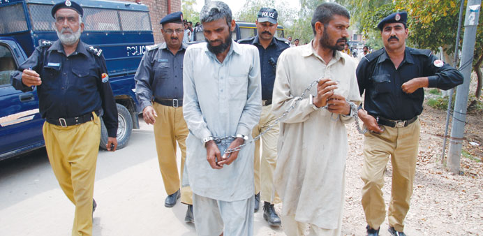 Farman Ali (right) and Arif Ali, two brothers previously convicted of cannibalism, are taken to a local court after they were arrested again for canni
