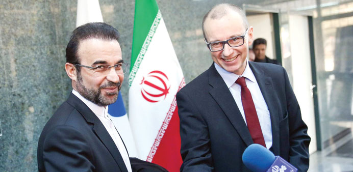 The deputy head of the International Atomic Energy Agency, Tero Varjoranta, and Iranu2019s IAEA envoy Reza Najafi shake hands after the agreement reached 