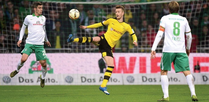 Borussia Dortmundu2019s Marco Reus  (centre) scored twice against Werder Bremen. (AFP)