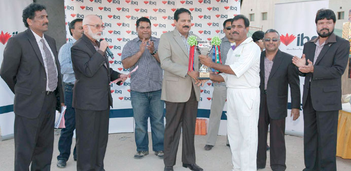 Captain Lateef and Surendra Kumar of Metabo receiving the winners trophy from Chandramohan Pillai, Head of Admin & Facilities u2014 IBQ