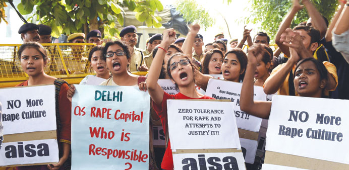 Students shout slogans during a protest against the rapes of two minor girls outside the police headquarters in New Delhi yesterday.