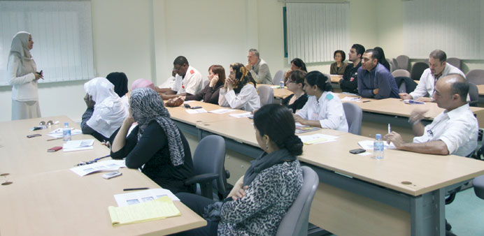 Participants at the workshop listen to a speaker.