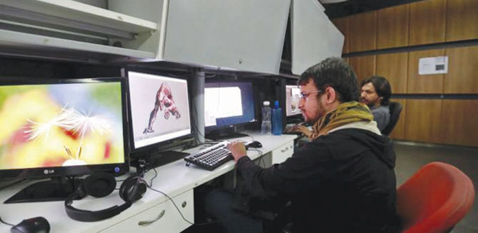 Prime Focus employees work inside a visual effects studio in Mumbai.
