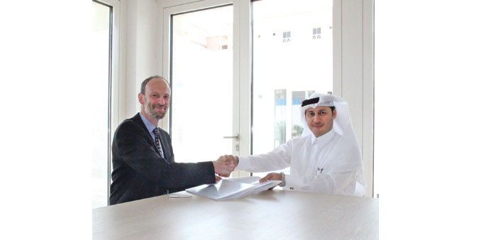 Dr Gu00f6ttsche and al-Shamari shake hands during a meeting at the Passivhaus, Baytna Project in Qatar.