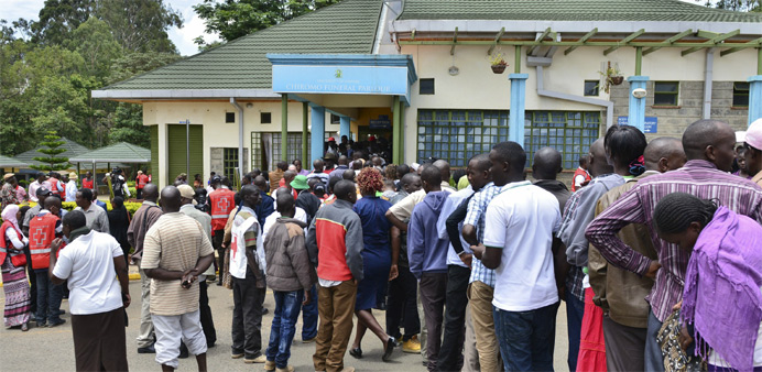 Mourners gather to view bodies of the students killed 