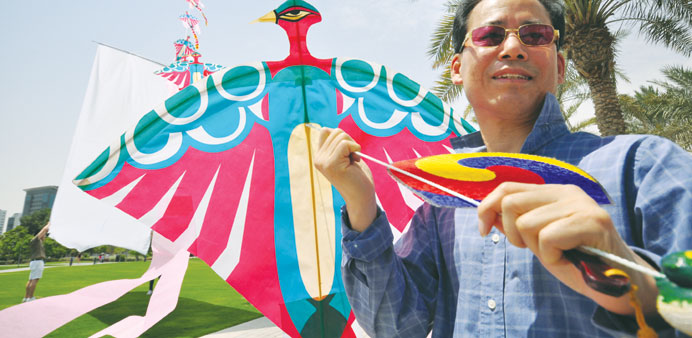 Consul Park makes his kite flying debut yesterday during the u201cMagnificent Korean Kite-flying Eventu201d held at the Museum of Islamic Art Park. PICTURE: P