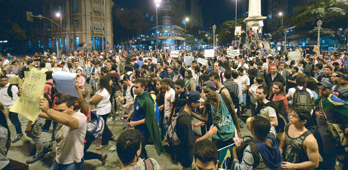 Demonstrators protesting in Belo Horizonte, Brazil, against higher public transport fares and the use of public funds to disrupt international footbal