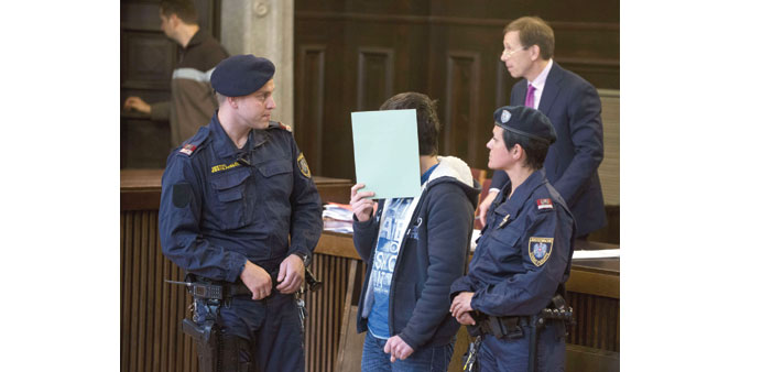  The 14-year-old entering the courtroom prior to the start of his trial yesterday, in St Poelten, Austria.