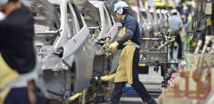 An assembly line for Japanese auto giant Toyota Motoru2019s hybrid vehicle Prius at the companyu2019s plant in Toyota in Aichi prefecture, central Japan. Germ