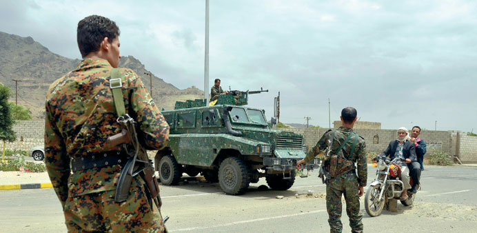 Yemeni soldiers manning a checkpoint at a street leading to the US and British embassies in Sanaa yesterday.