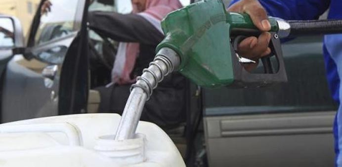 A container is being filled with diesel at a gas station in Riyadh in this file picture.