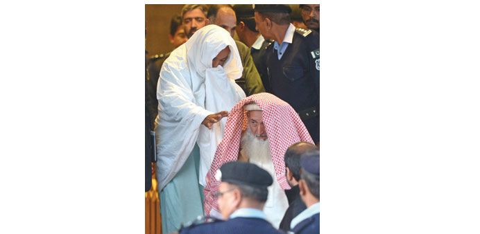 Pakistani policemen escort newly-identified missing persons following an identification process as they leave the Supreme Court building in Islamabad 