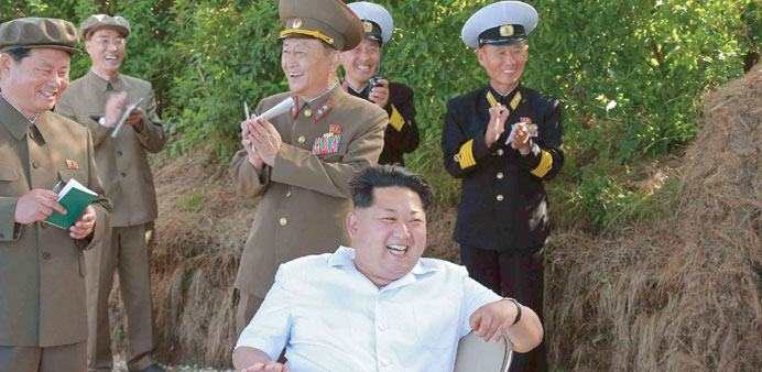 North Korean leader Kim Jong-Un watching naval drills.