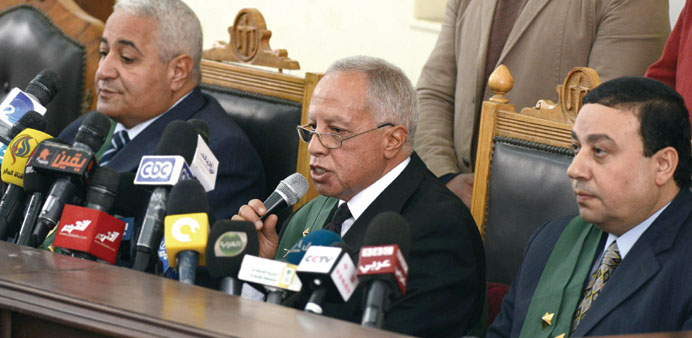 Egyptian judge Moataz Khafagy speaks during a trial of members of the Muslim Brotherhood at the non-commissioned police officers institute in the capi
