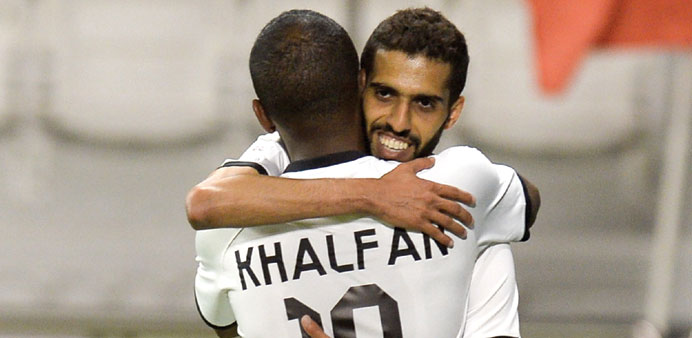 Al Saddu2019s Hassan al-Haydos (facing camera) congratulates teammate Khalfan Ibrahim after the latter scored a goal against Al Arabi yesterday. 