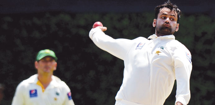 In this photograph, Pakistan cricketer Mohammad Hafeez delivers a ball during the second Test match between Sri Lanka and Pakistan.