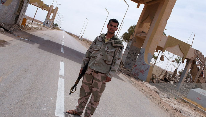 A Misratan fighter guards a checkpoint near the outskirts of Sirte. Picture courtesy: Getty Images