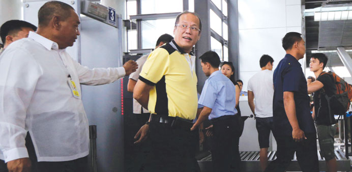 Philippines President Benigno Aquino conducts an inspection at an airport in Pasay city, south of Manila yesterday.