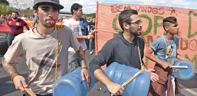 Demonstrators march towards the national stadium to protest against public spending for the 2014 World Cup in Brasilia yesterday.