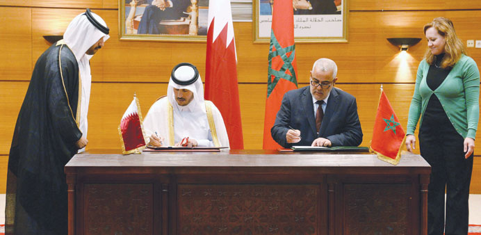 HE Sheikh Abdullah bin Nasser bin Khalifa al-Thani and Abdelilah Benkirane signing a co-operation accord during a meeting in Rabat yesterday.