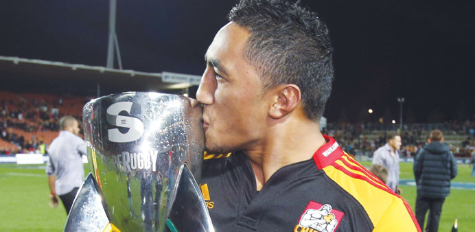 Chiefs Bundee Aki celebrates with the Super 15 trophy after their Super 15 rugby match between the Chiefs and the Brumbies at Waikato Stadium in Hamil